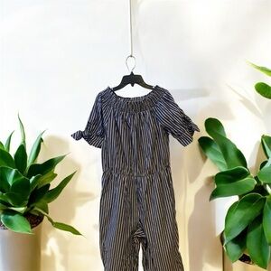 Gray with white jumpsuit has been used it’s in good condition